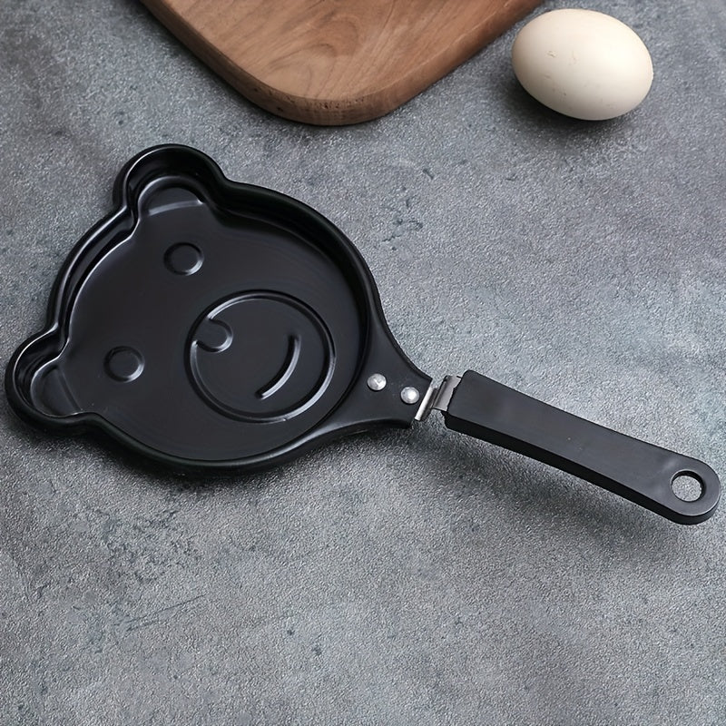 Bear-shaped omelet pan made of cast iron, with non-stick coating and a sturdy handle. This breakfast cookware is dishwasher safe and also doubles as a pancake and steak griddle in the kitchen.