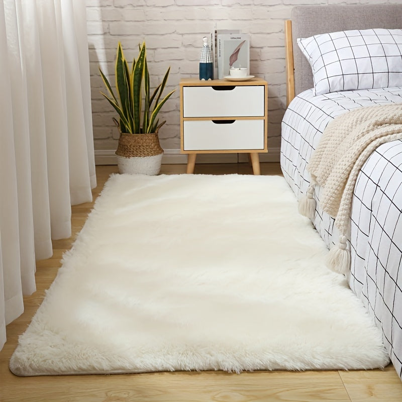 One piece of plush, fluffy area rug designed for bedrooms. This soft, fuzzy shaggy rug is black in color and rectangular in shape, perfect for adding warmth to your living room. It features a non-slip bottom to ensure safety. Great for Halloween or