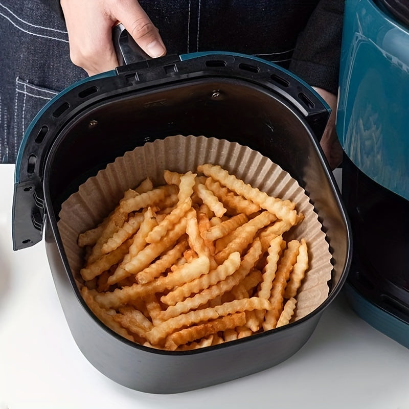 70 pieces of non-stick air fryer liners measuring 16.0cm, perfect for baking, cooking, and microwave use. These disposable paper bowls are oil and grease resistant, making them essential kitchen accessories.