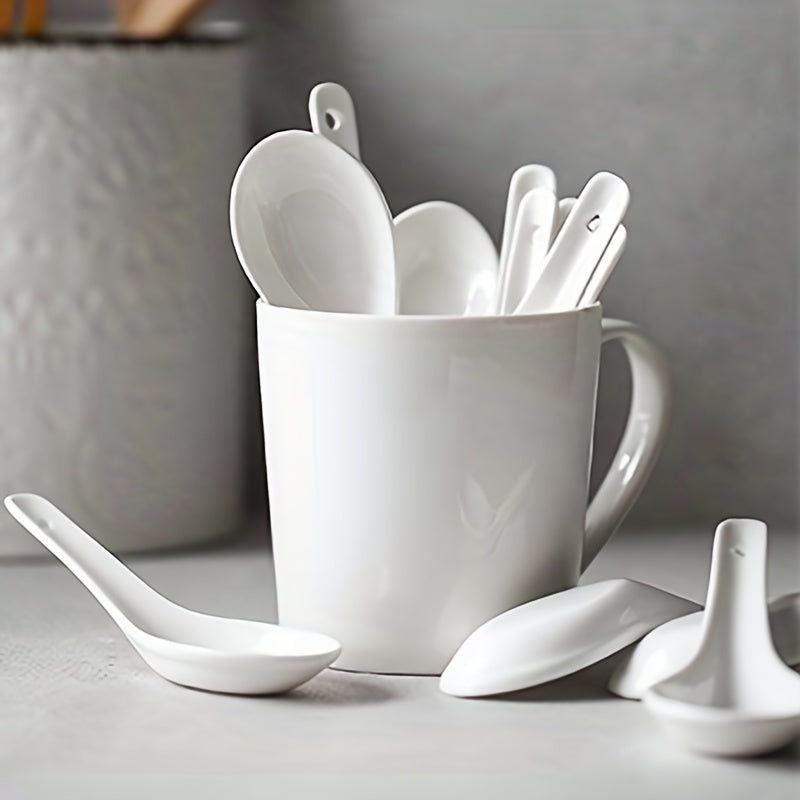 6-piece set of white ceramic soup spoons for various dishes, safe to use in microwave, oven, dishwasher, and freezer.