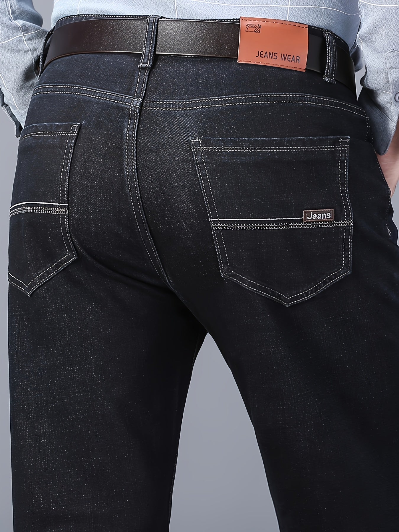 Straight leg denim jeans with classic design, slightly stretchy for versatility in business and leisure wear.