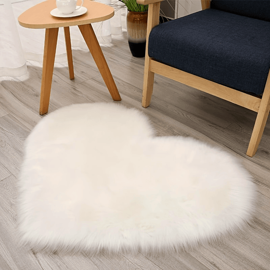 Heart-shaped fluffy area rug, made of plush faux fur, perfect for adding comfort and style to your living room or bedroom. This shaggy rug also works great as a decorative indoor mat, adding a touch of luxury to any room. Available in two sizes