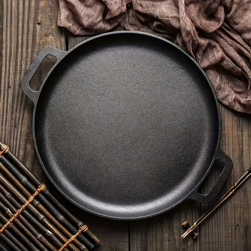 Multi-function cast iron griddle skillet for pizza, BBQ, and pancakes. Non-stick pan suitable for all stovetops. Ideal for home and outdoor cooking.