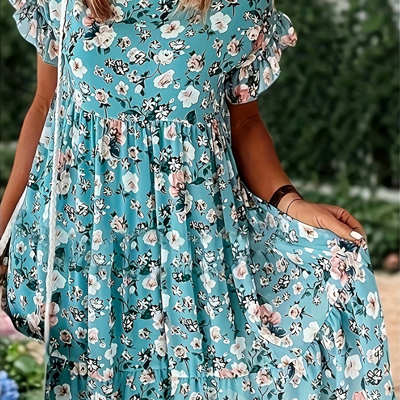 Elegant floral print plus size dress with ruffle detail. Navy blue with pink flowers, perfect for spring and summer. Casual chic style.