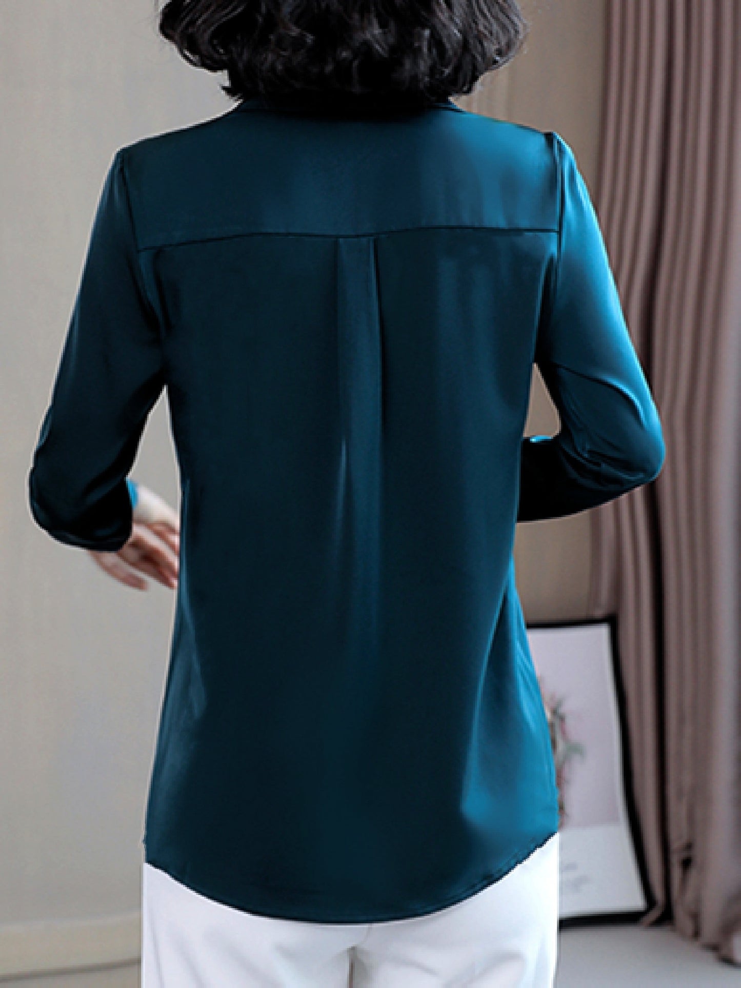 Long sleeve satin shirt with solid color, collared button-up design for women. Machine washable and perfect for spring/fall. Ideal for sophisticated adults with luxurious style.