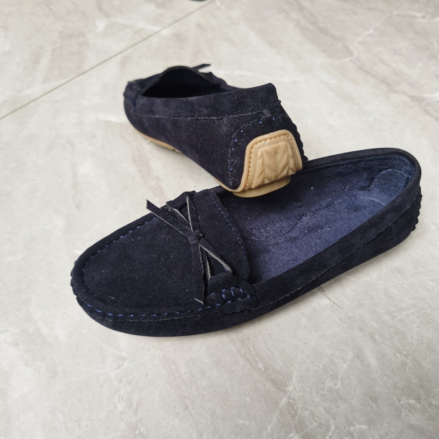 Retro flat loafers with bow detail, slip on style, and soft sole for casual wear.