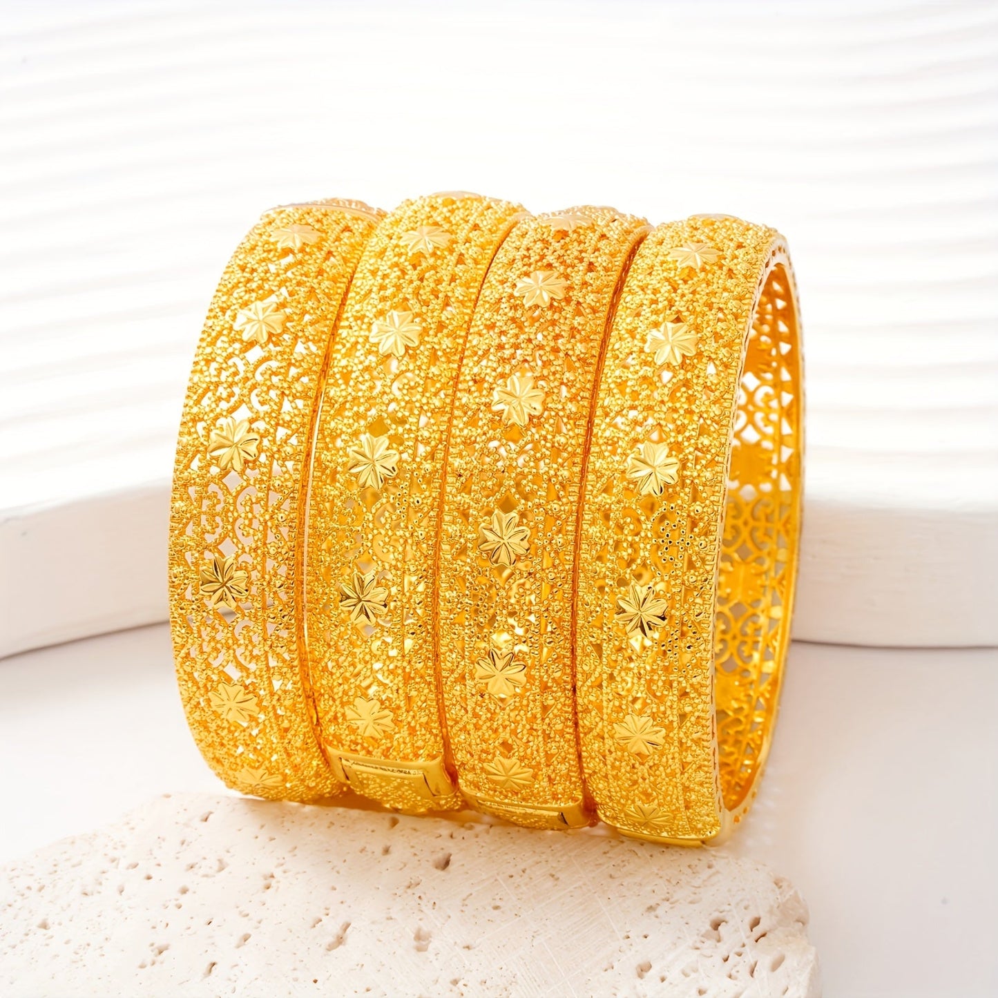 Two pieces of beautiful Golden Open Bracelet with Elegant Hollow Design, perfect for Middle Eastern and Saudi Arabian Festivals. An exquisite gift for women's fashion, ideal for Dubai brides. This hand ornament showcases European and American Ethnic