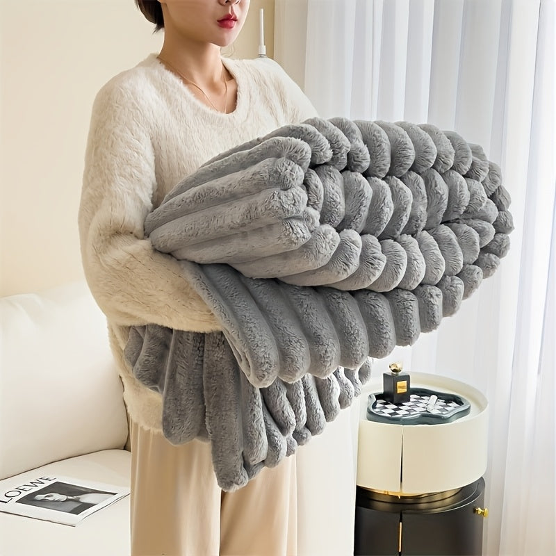 Soft, warm, and luxurious, this contemporary double-sided faux rabbit fur throw blanket is perfect for cuddling up on the couch or bed. Made of polyester knit, it is machine washable for easy care. Whether you're at home or on the go, this all-season