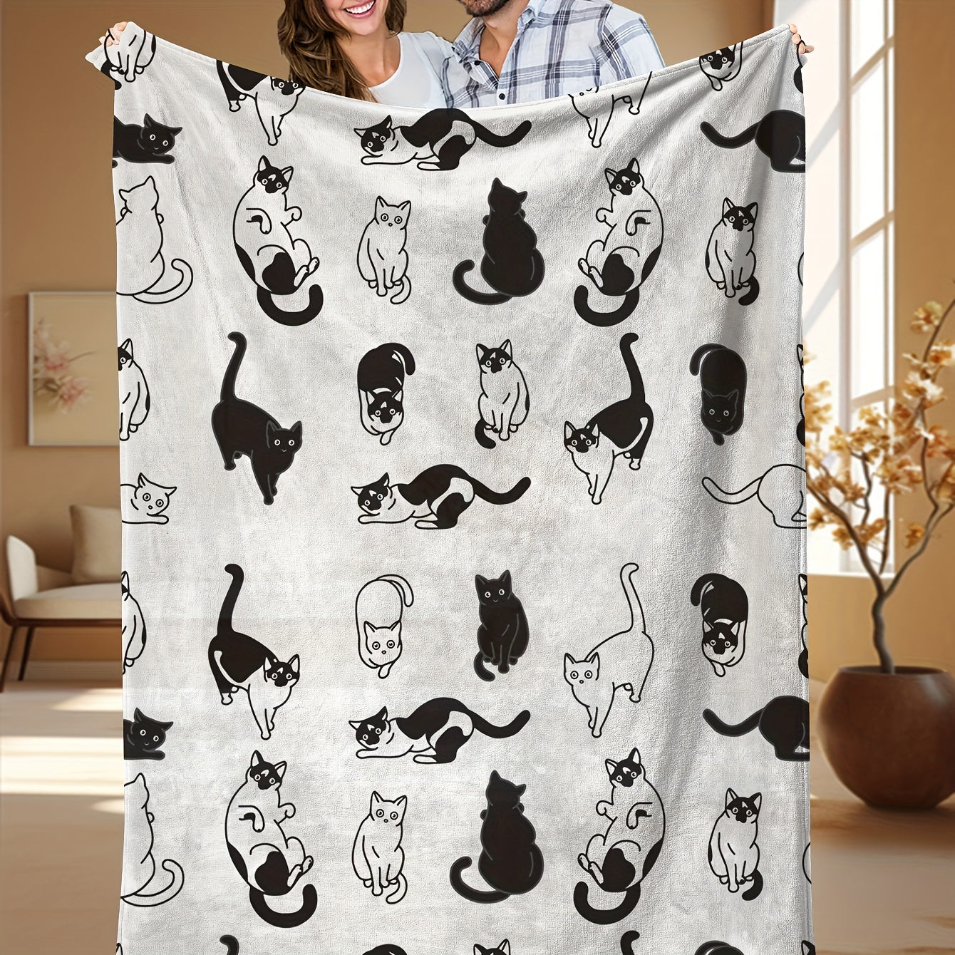 Soft and cozy fleece throw blanket featuring an adorable cartoon kitty print. Perfect for all seasons, this blanket is suitable for home, office, camping, and travel. Made from durable polyester fabric, it is machine washable for easy care. With a