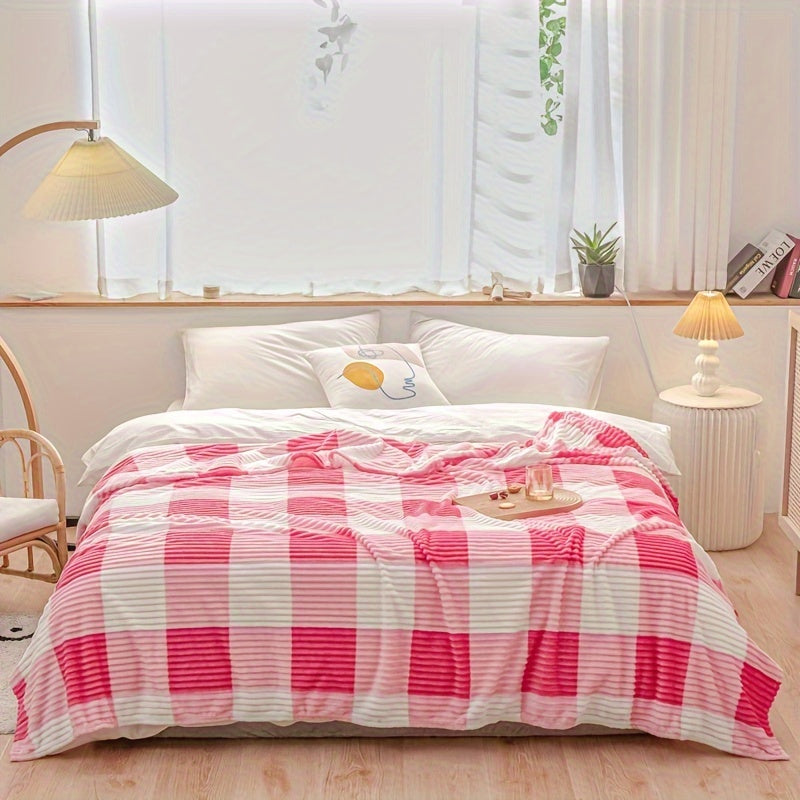 A cozy fleece blanket with whimsical stripes, ideal for snuggling up at work or having a quick snooze.