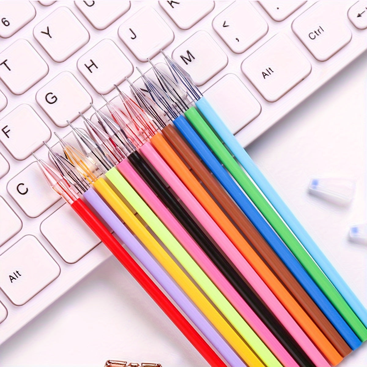 Set of 12 candy-colored 0.5mm refills for note-taking.