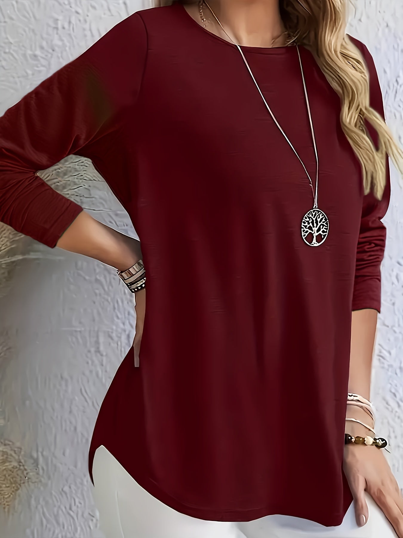 Elegant long-sleeve tops for plus-size women with button detail on the back, perfect for spring and autumn.