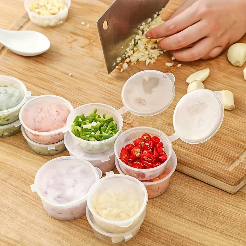 50 transparent disposable sauce boxes for takeout, packaging, and seasoning. These multipurpose food storage boxes come with covers.