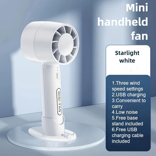 Small, portable fan that is rechargeable via USB, featuring 3 speed settings and a base stand. Ideal for use at home, in the office, or while traveling outdoors. Comes in a sleek white color.