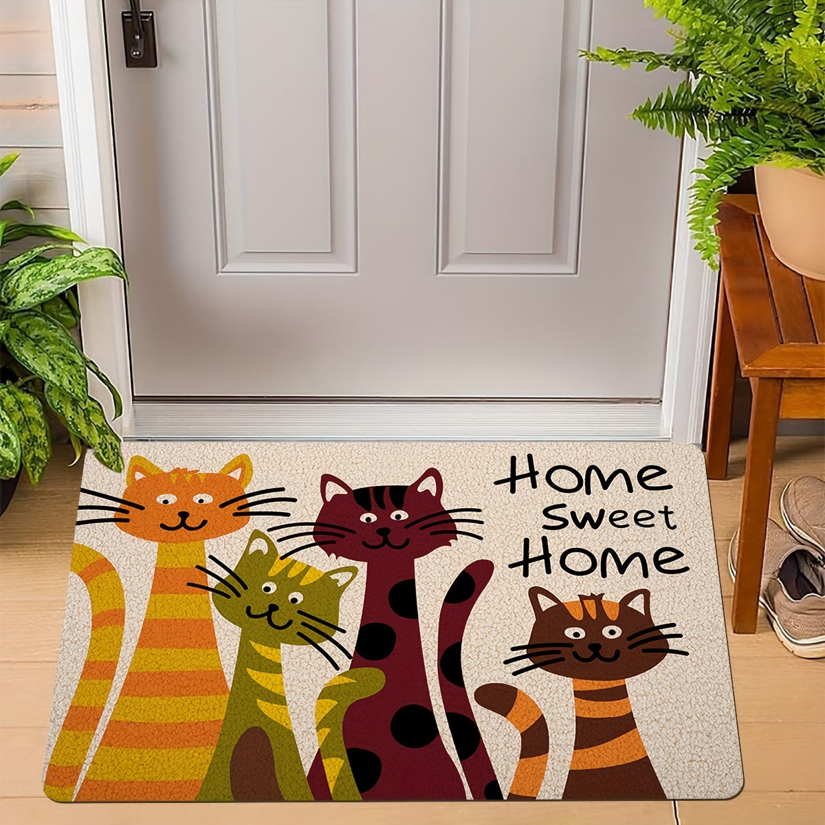 One piece of an entrance floor mat, featuring a giant cat homecoming alphabet print pattern. Made of polyester, this non-slip and stain-resistant floor mat is suitable for indoor and outdoor use as a doormat for the entrance.