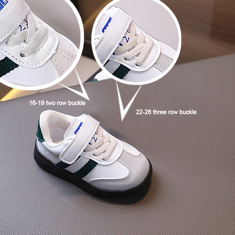 Minimalist unisex toddler sneakers with solid color, adjustable strap closure, slip-resistant sole, and breathable fabric.