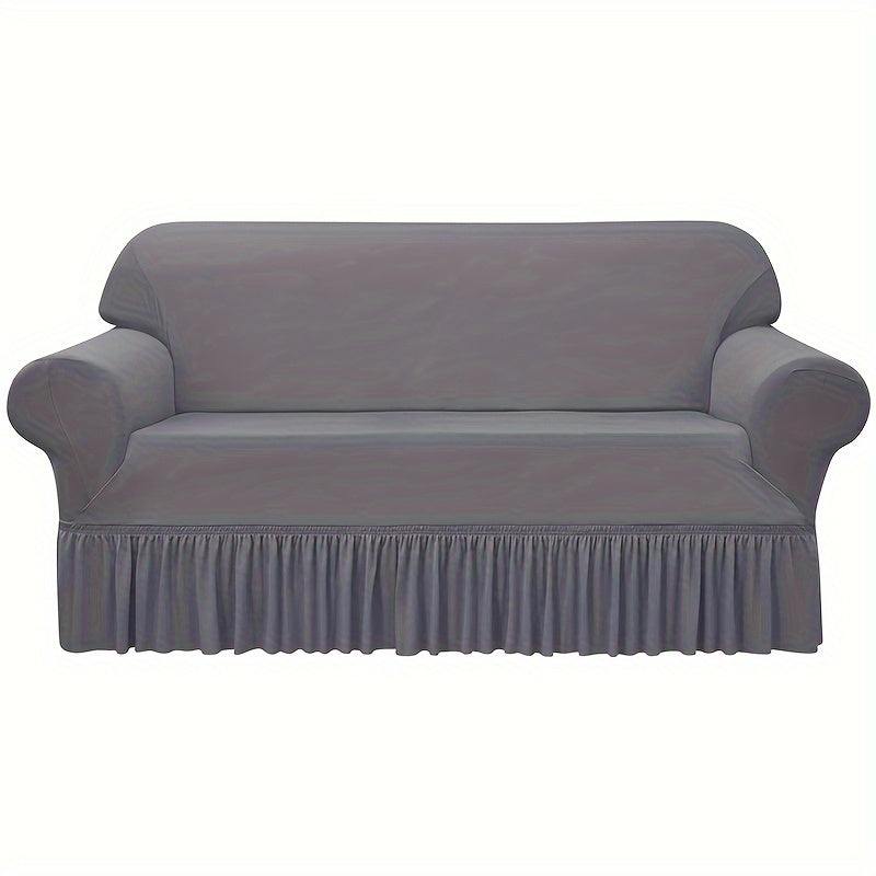 Elastic waterproof sofa slipcover with skirt for all seasons, ideal furniture protection for home and office.