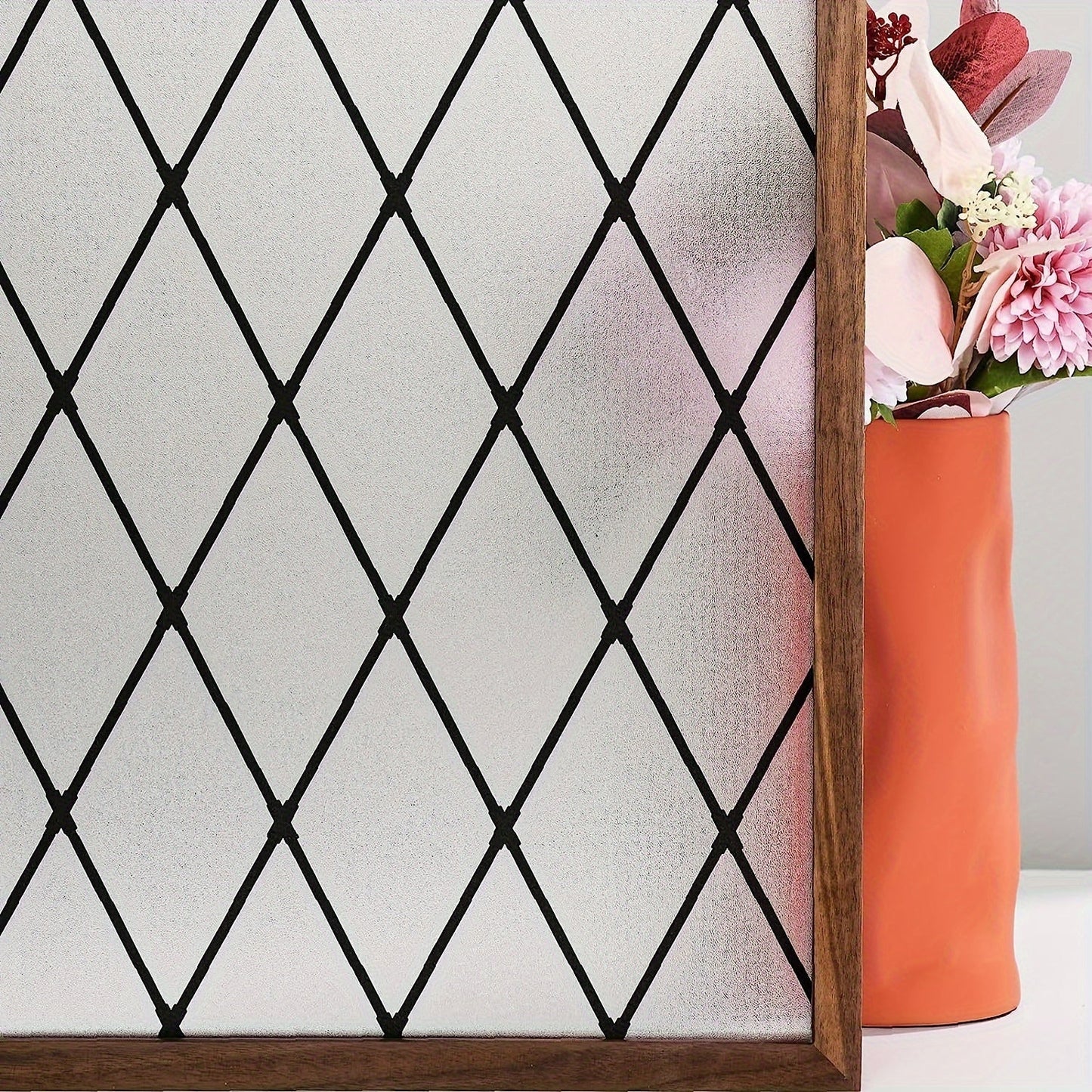 Privacy window film in a black lattice design that is 5mil thick, static cling frosted glass door cover with UV protection. Easy to install for home decor.