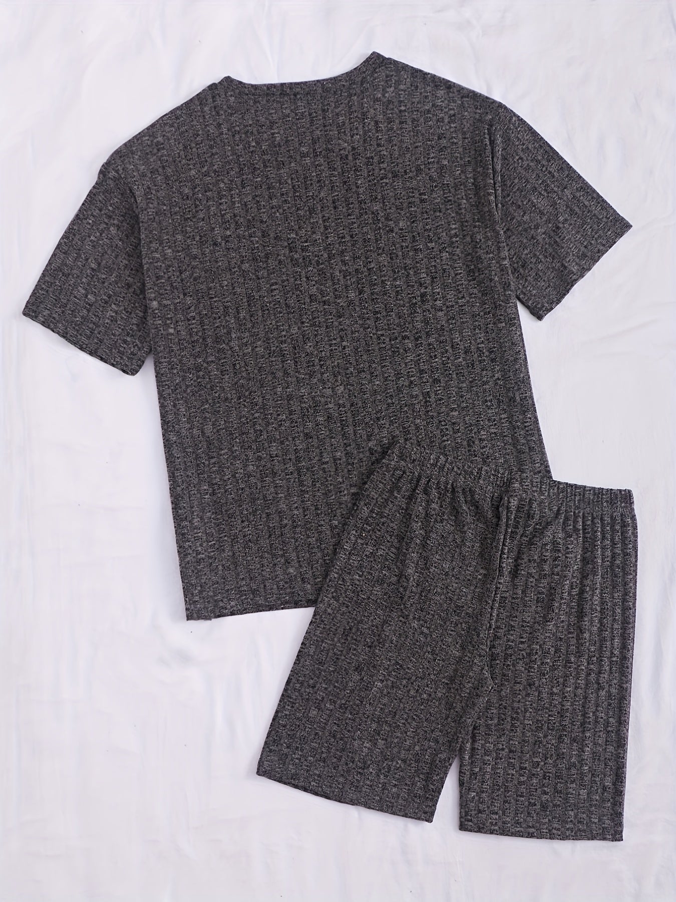 Casual rib-knit viscose pajama set for women with crew neck half sleeve top and shorts. Made of polyester (60%), viscose (35%), and elastane (5%). Suitable for all seasons.