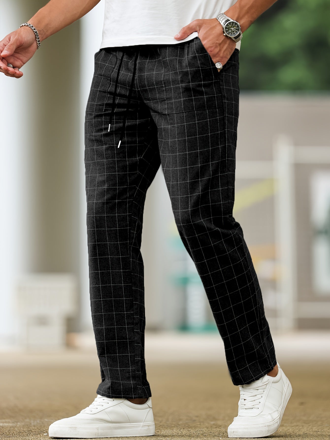 Men's polyester pants with drawstring waist, ideal for spring and fall, featuring casual striped plaid pattern.