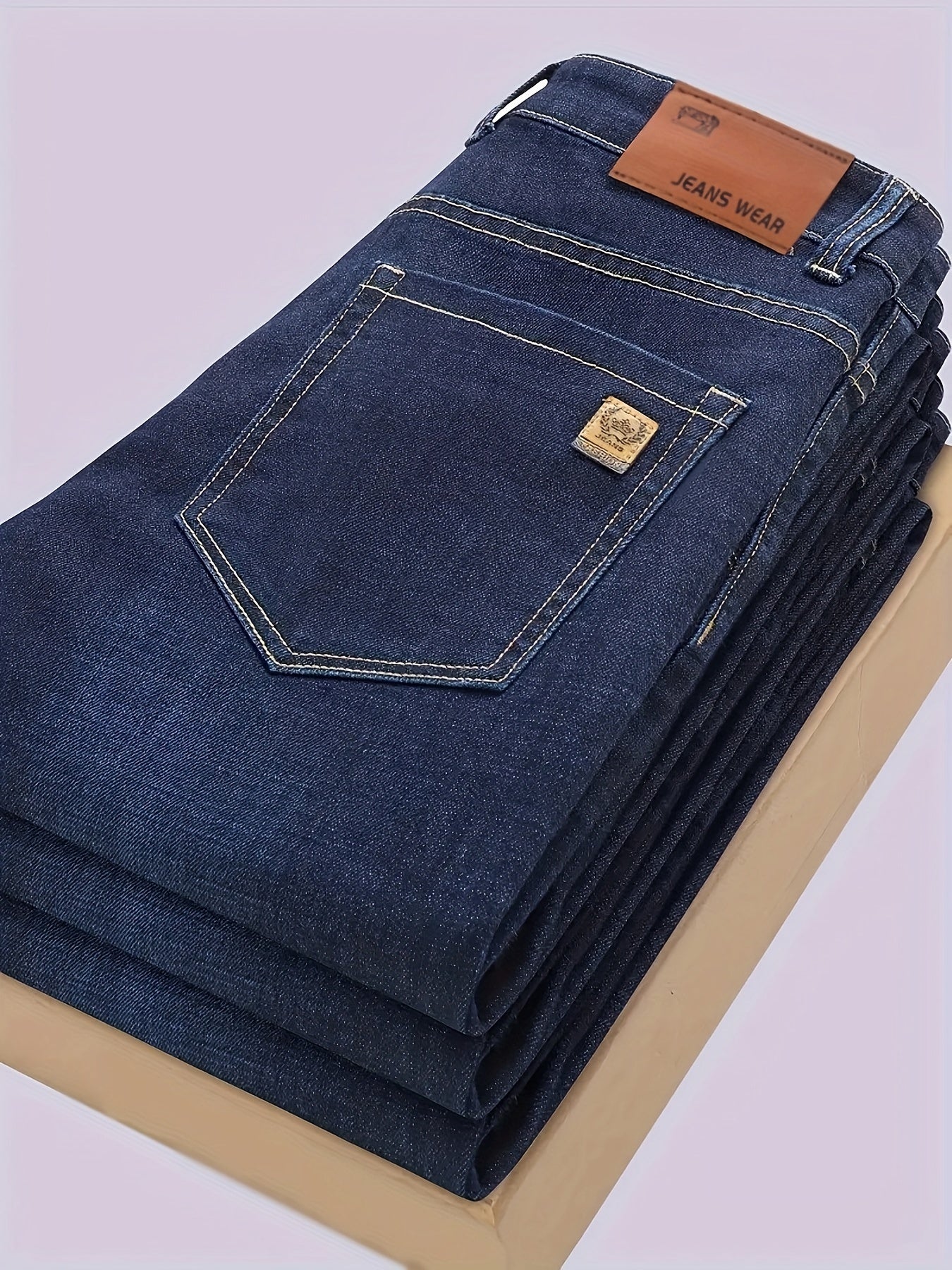 Men's straight-leg jeans in classic washed denim, made with a cotton-polyester blend and slight stretch for comfort. Solid color, regular fit, suitable for business casual attire.