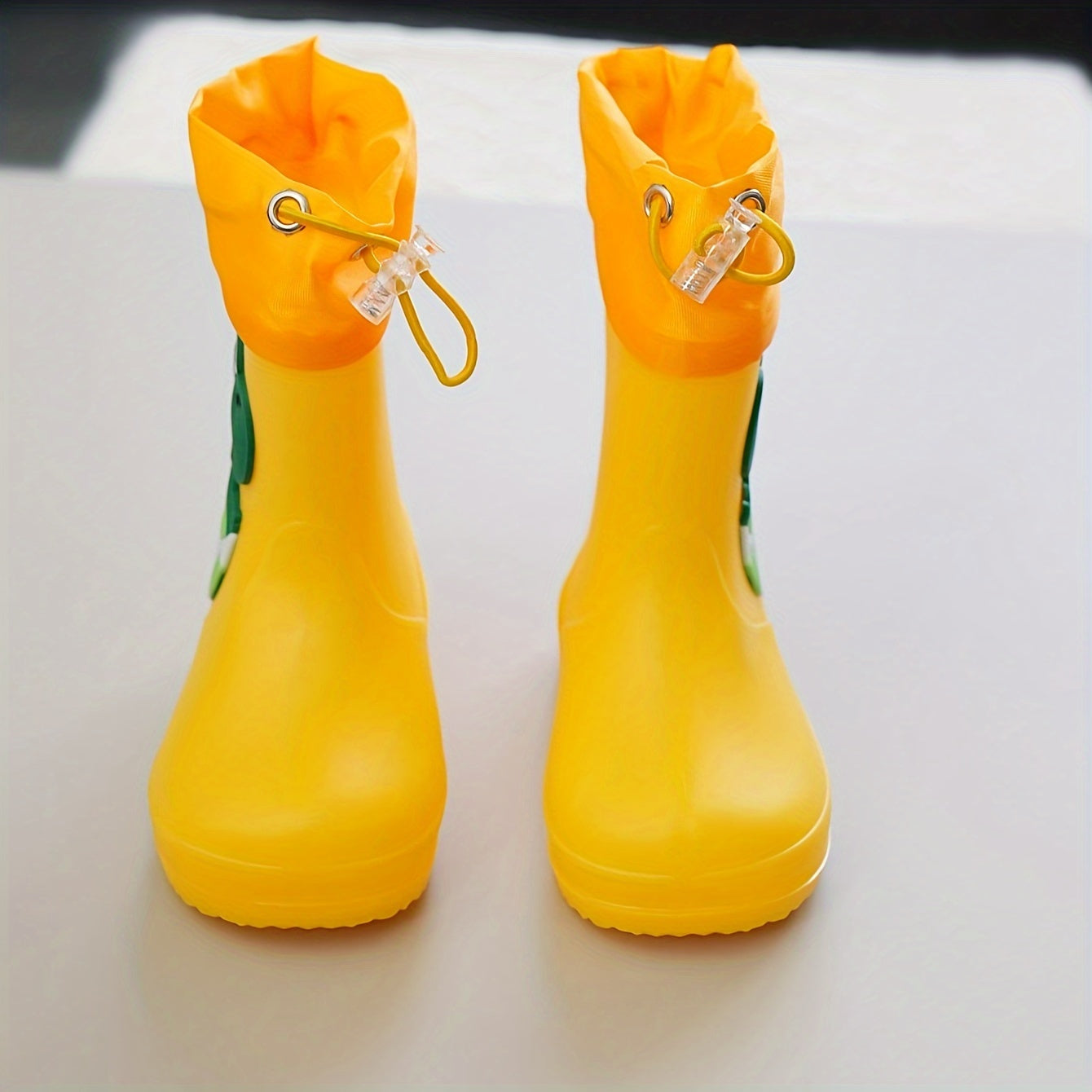 Children's cartoon rain boots, PVC water shoes, long boot style, for boys and girls ages 14 and under, suitable for outdoor school use.