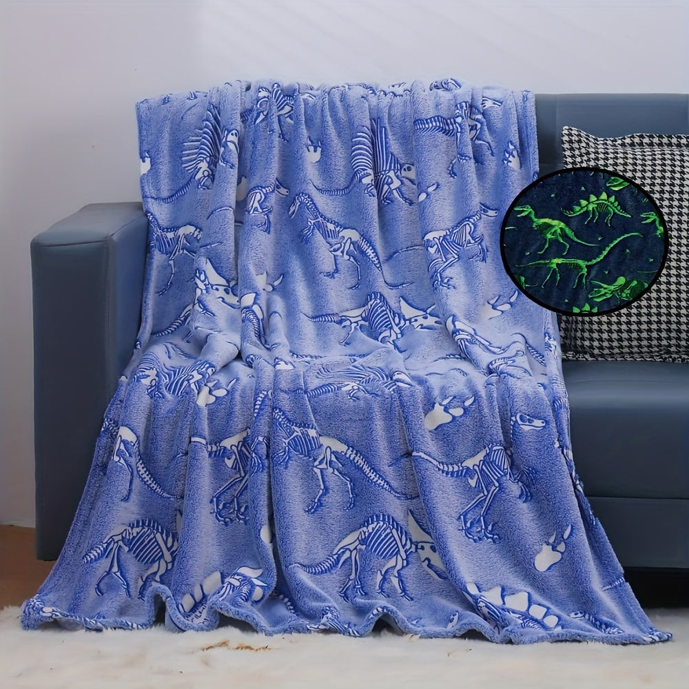 The perfect gift for dinosaur enthusiasts - a cozy blue luminous polyester throw blanket that glows in the dark.