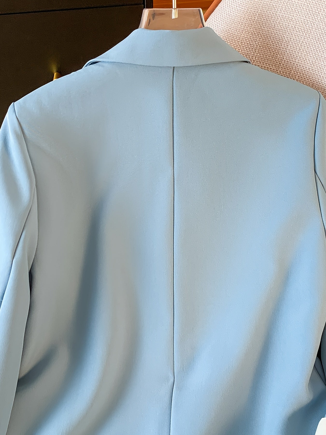 Stylish light blue blazer with golden button details for women, ideal for work in spring and fall.