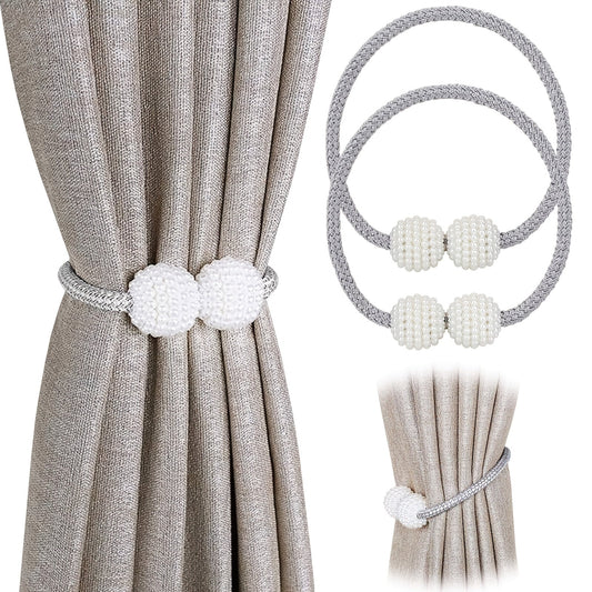 Two elegant magnetic curtain tiebacks featuring contemporary polyester rope holdbacks adorned with pearl-like beads. Add a stylish touch to your home or office decor with these decorative window drapery ties. The contemporary design and bead detailing