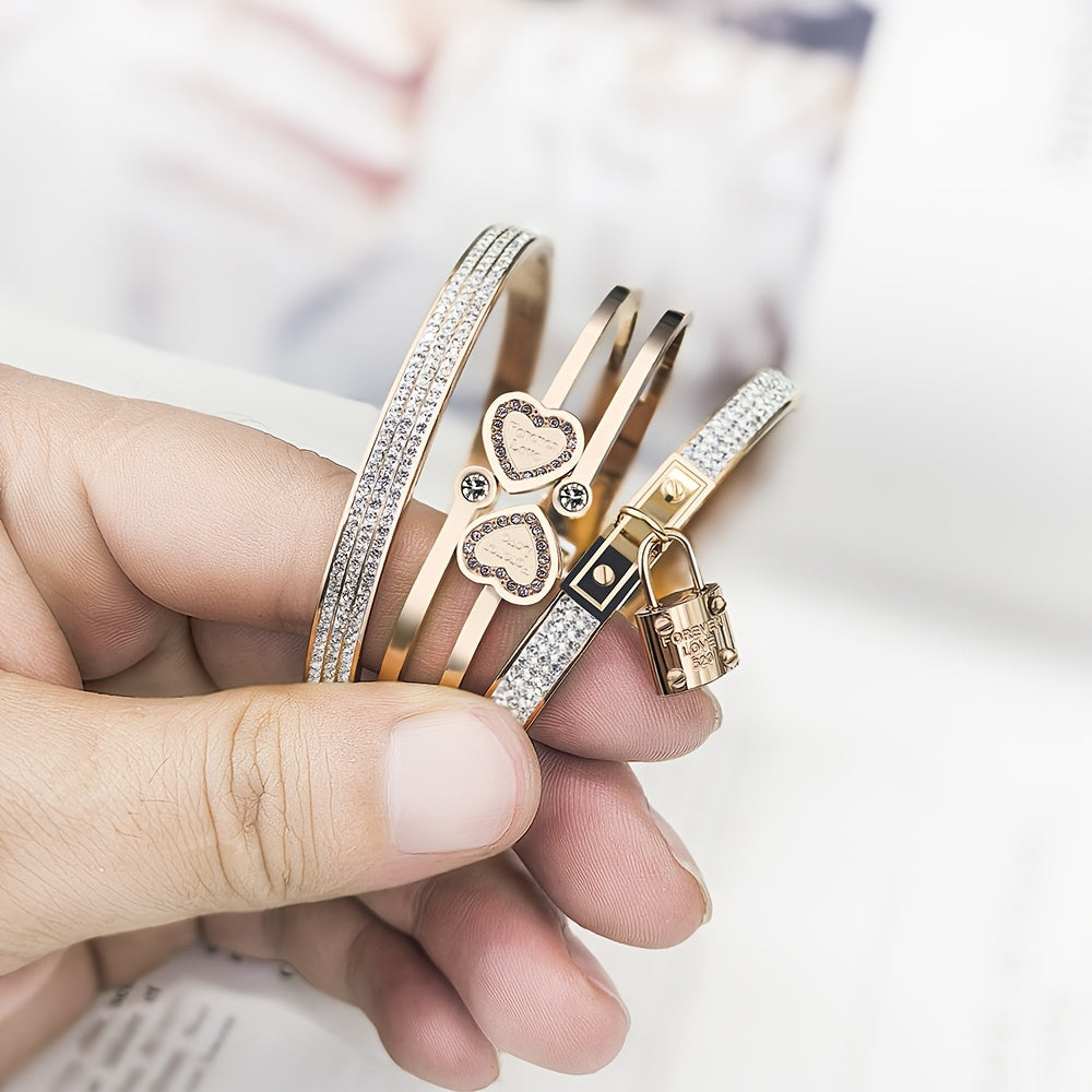 Stylish set of 3 stainless steel bracelets for women, plated in 18K gold with a heart-shaped pendant adorned with sparkling synthetic zirconia. The perfect luxury gift for weddings, parties, and Christmas, suitable for all seasons.