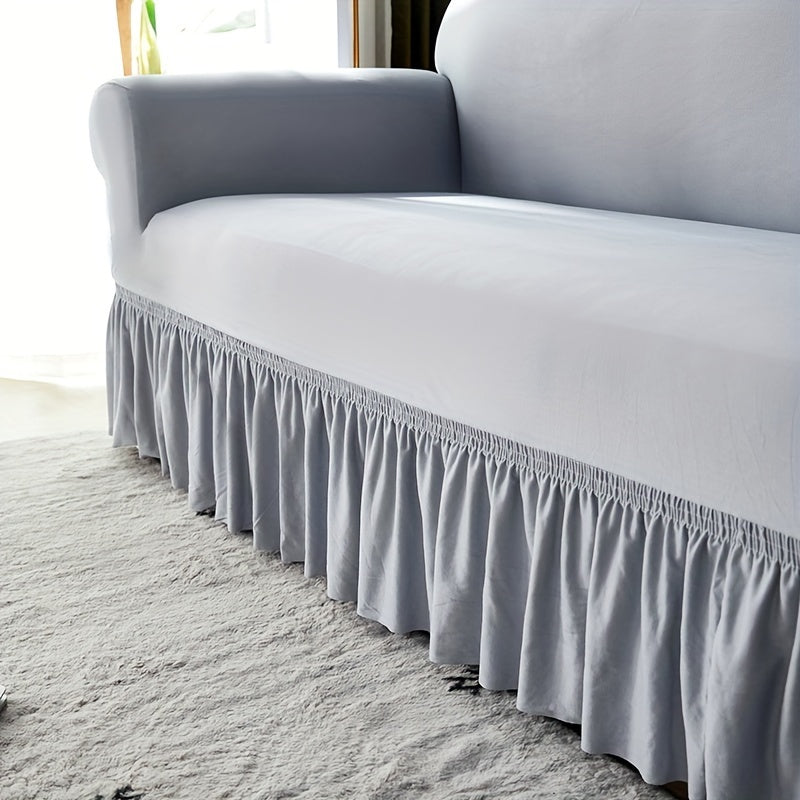 Elastic sofa cover with skirt, universal for all seasons, suitable for living room, office, and home decor.