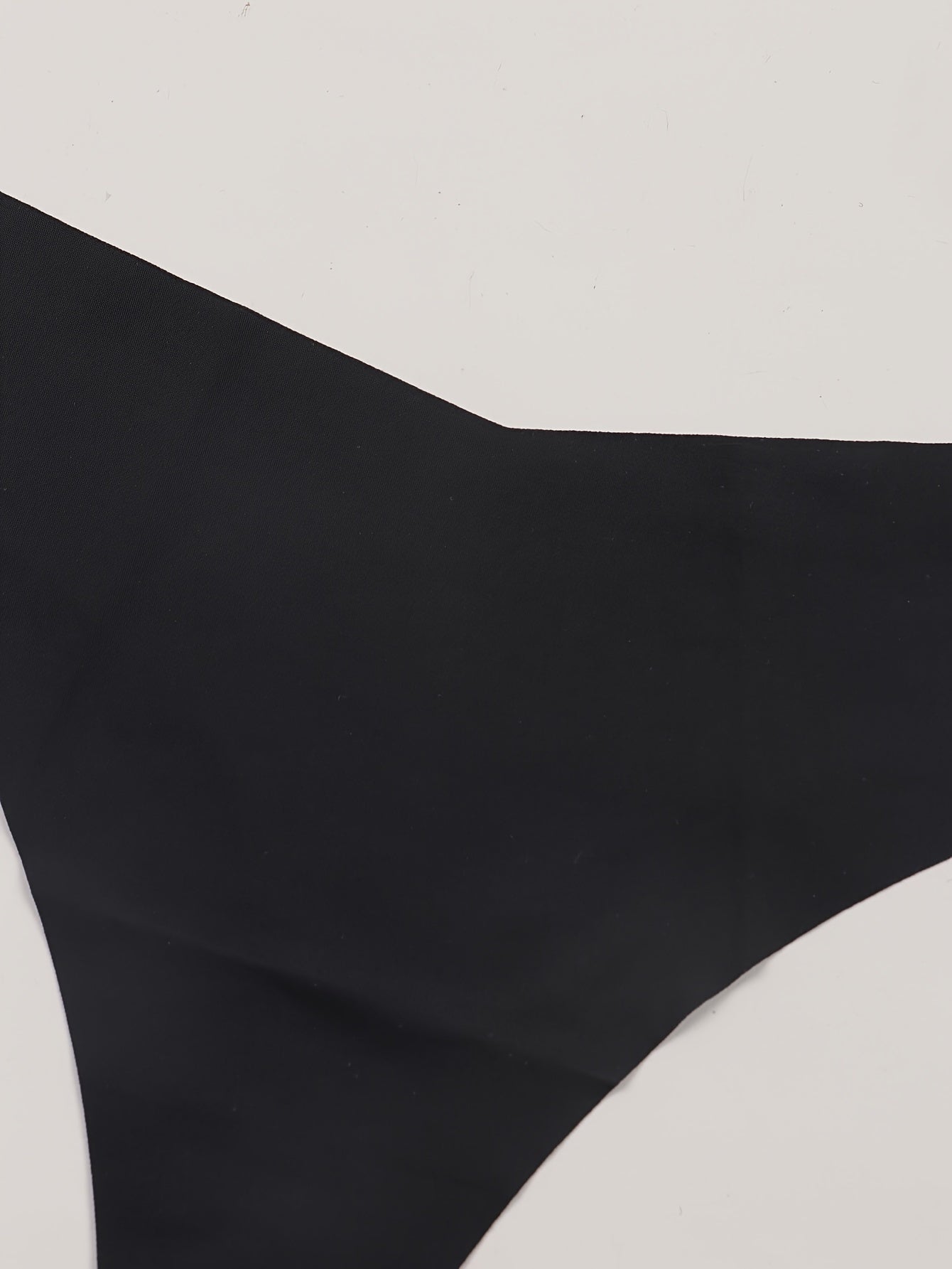 Solid black low waist thongs for women, sexy lingerie and underwear.