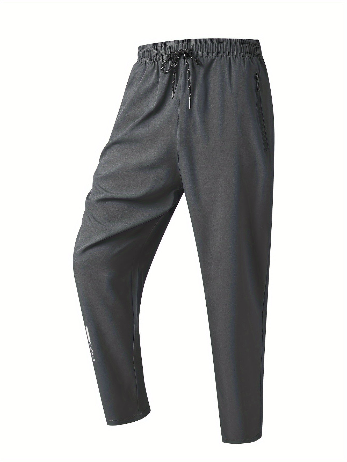 Men's loose-fit polyester pants, breathable and quick-drying, perfect for running and fitness. Features regular length, zipper detail, and printed pattern, ideal for spring and fall.