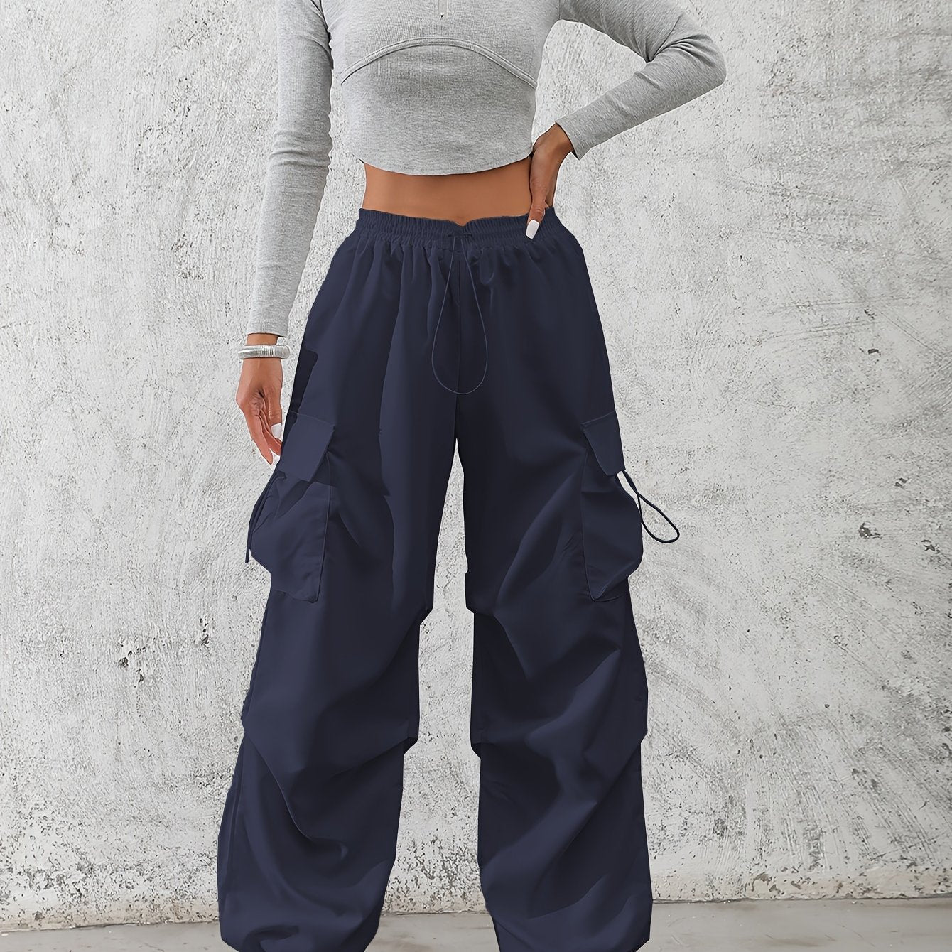 Casual flap pocket cargo pants in solid color for women.