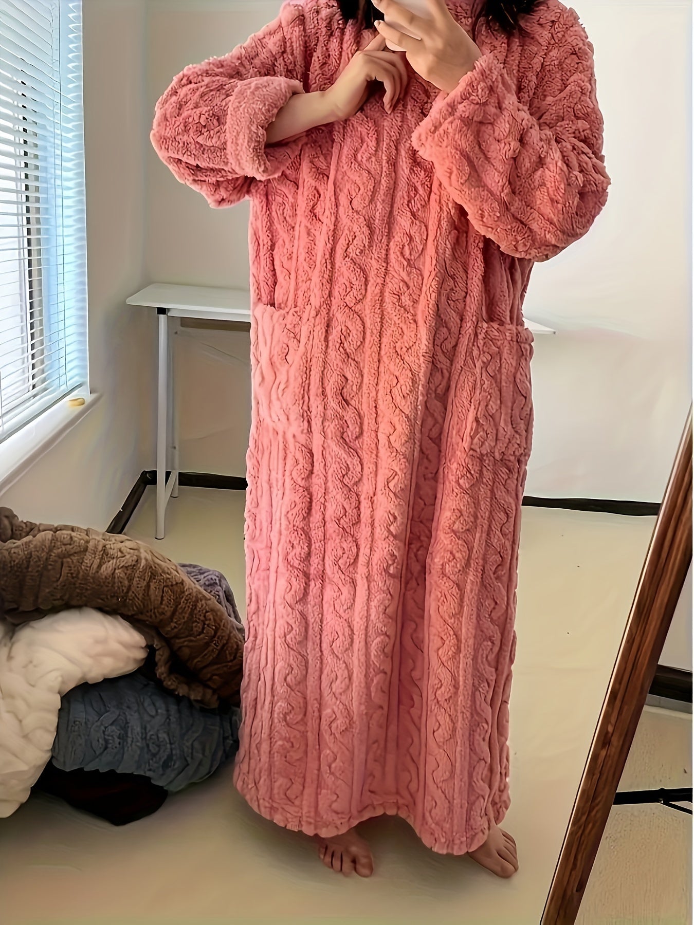 Cozy coral fleece nightdress with pockets, perfect for winter.