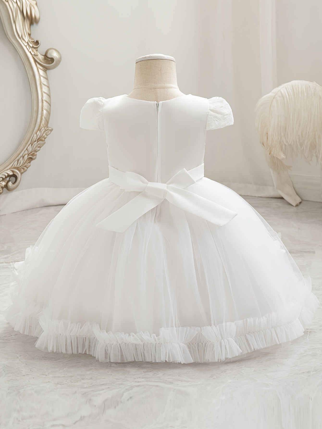 Baby's floral tulle princess dress with lace sleeves for formal occasions.