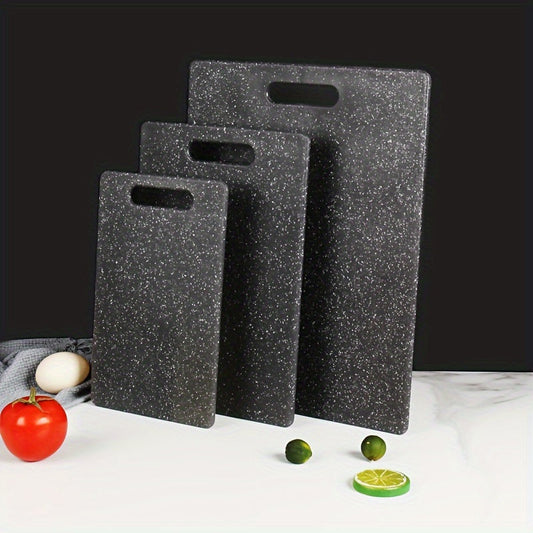 Set of three cutting boards with a marble pattern made of food-safe polystyrene. Suitable for chopping fruits and vegetables, these boards are durable, easy to clean, and feature a stylish black and white marble design.