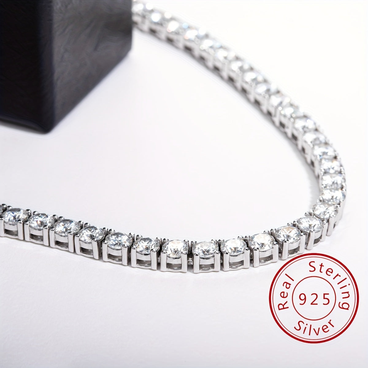 This exquisite Cuban hip hop fashion necklace features a 4.0mm mixed row of Moissanite stones set in 925 sterling silver. Available in 18, 20, 22, and 24 inch lengths, with 106, 118, 129, and 142 pieces respectively. Weighing approximately 38.5 grams