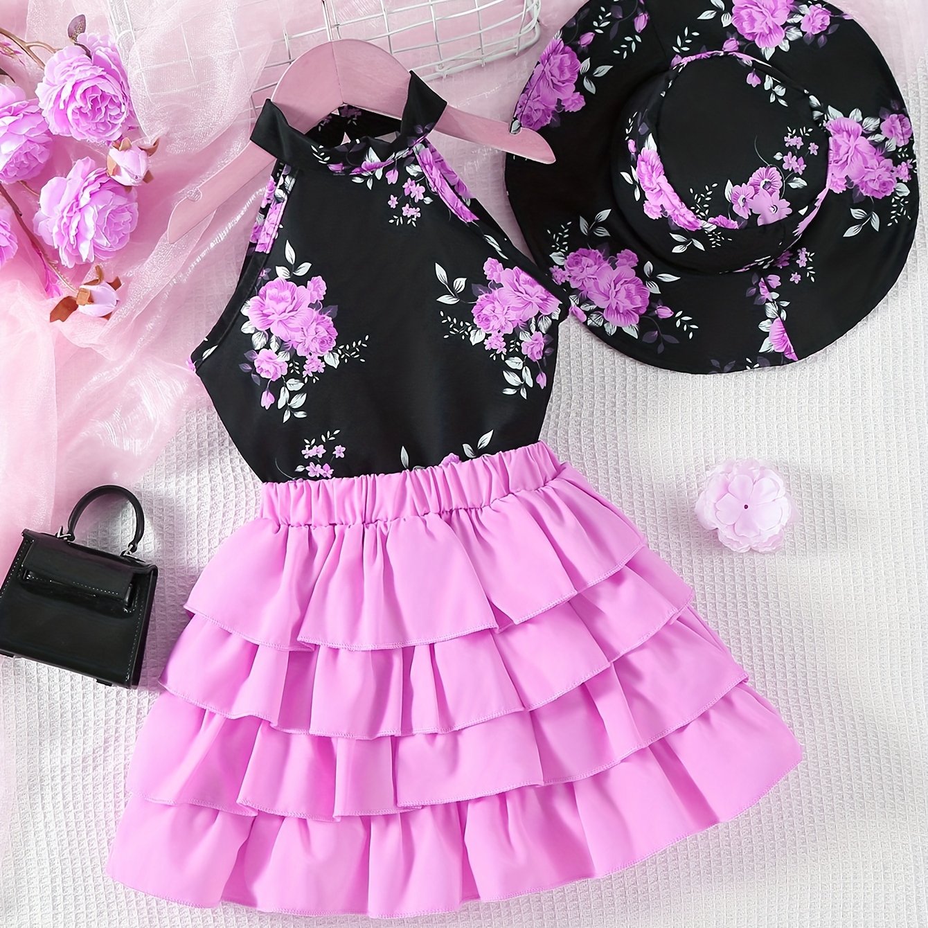 Floral garter top, layered skirt, and hat for young girls.