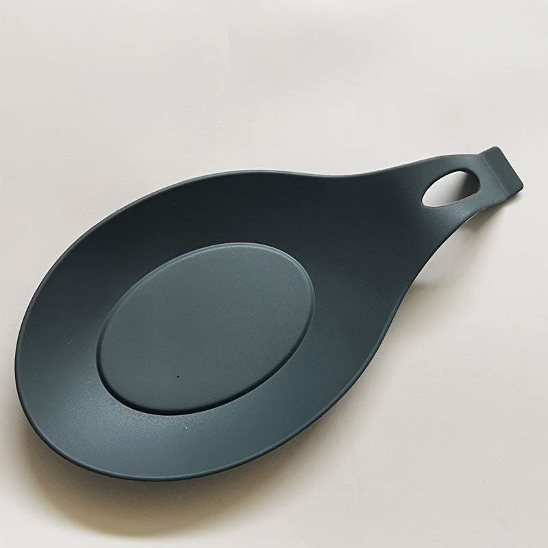 Silicone spoon rest for kitchen utensils - Easy to clean, heat-resistant holder for spoons and seasonings.