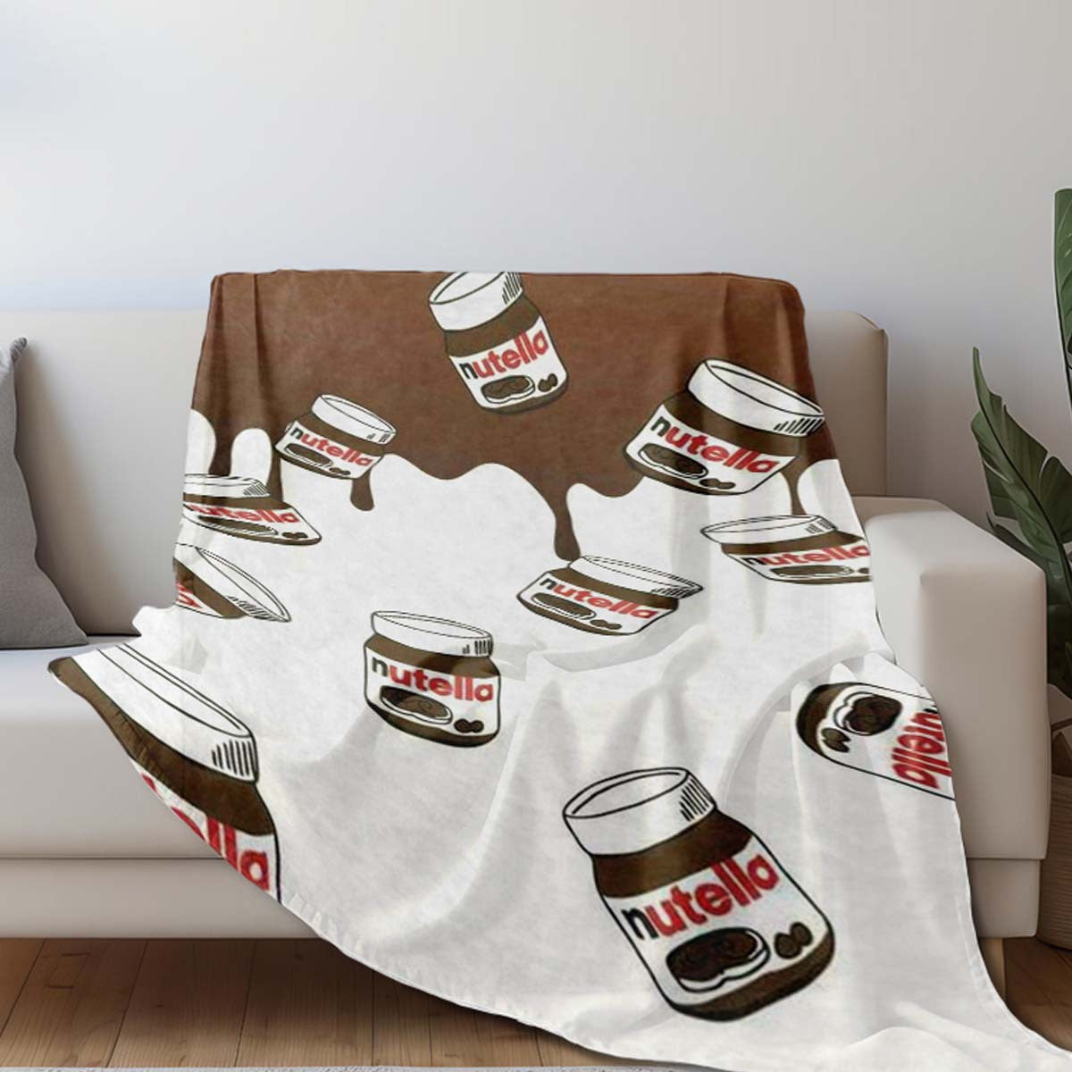 Cozy up with this luxurious Nutella Chocolate Spread Art Flannel Fleece Throw Blanket. Featuring a digital print design, this soft and cozy wrap is perfect for use on the sofa, in the office, on the bed, or while traveling. The glamorous Nutella pattern