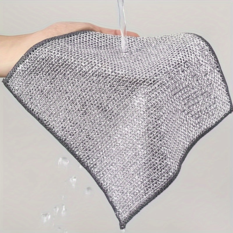 Kitchen scrubbing pads with a double-layer silvery edge are available in packs of 5 or 15. These scratch-resistant cloths can be used wet or dry for cleaning tableware, steel wire, and various surfaces such as bathroom doors and windows. The magic