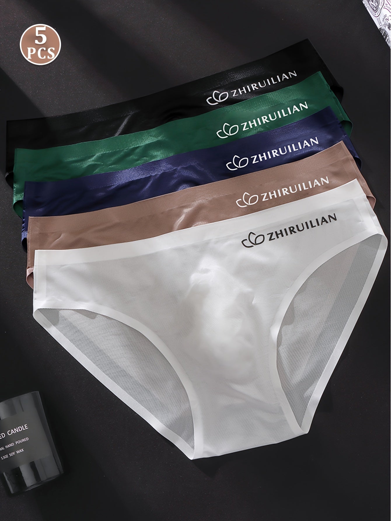 5-pack of men's seamless boxer briefs made of 68% nylon and 32% spandex knit fabric. Lightweight, stretchy, and comfortable with a solid color and letter print design. 150gsm.