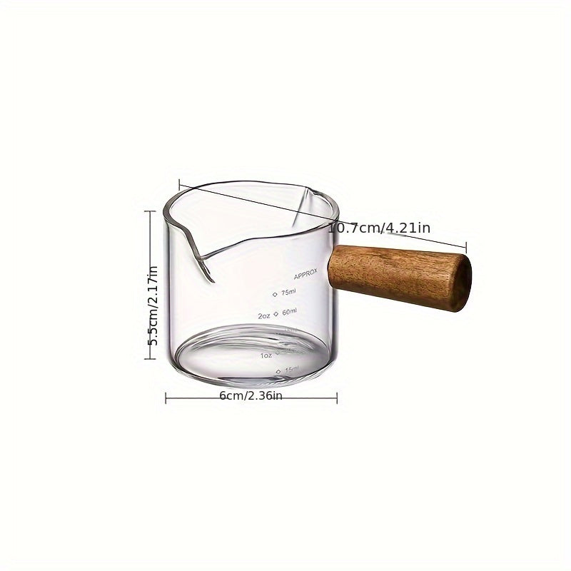 Small and stylish, this 2oz measuring cup features a heat-resistant glass body and a convenient wooden handle for easy use. With dual spout, scale markings, and ideal for measuring small quantities, this cup is perfect for both coffee and kitchen use.