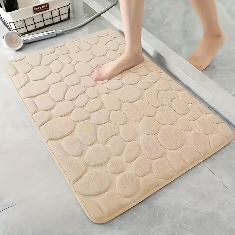 Luxurious red memory foam bath mat with geometric pattern for bathroom floors. Non-slip, soft polyester material that is quick-drying and absorbent. Hand washable, fragrance-free with a textured surface and machine-knit design. Perfect for a quick dry