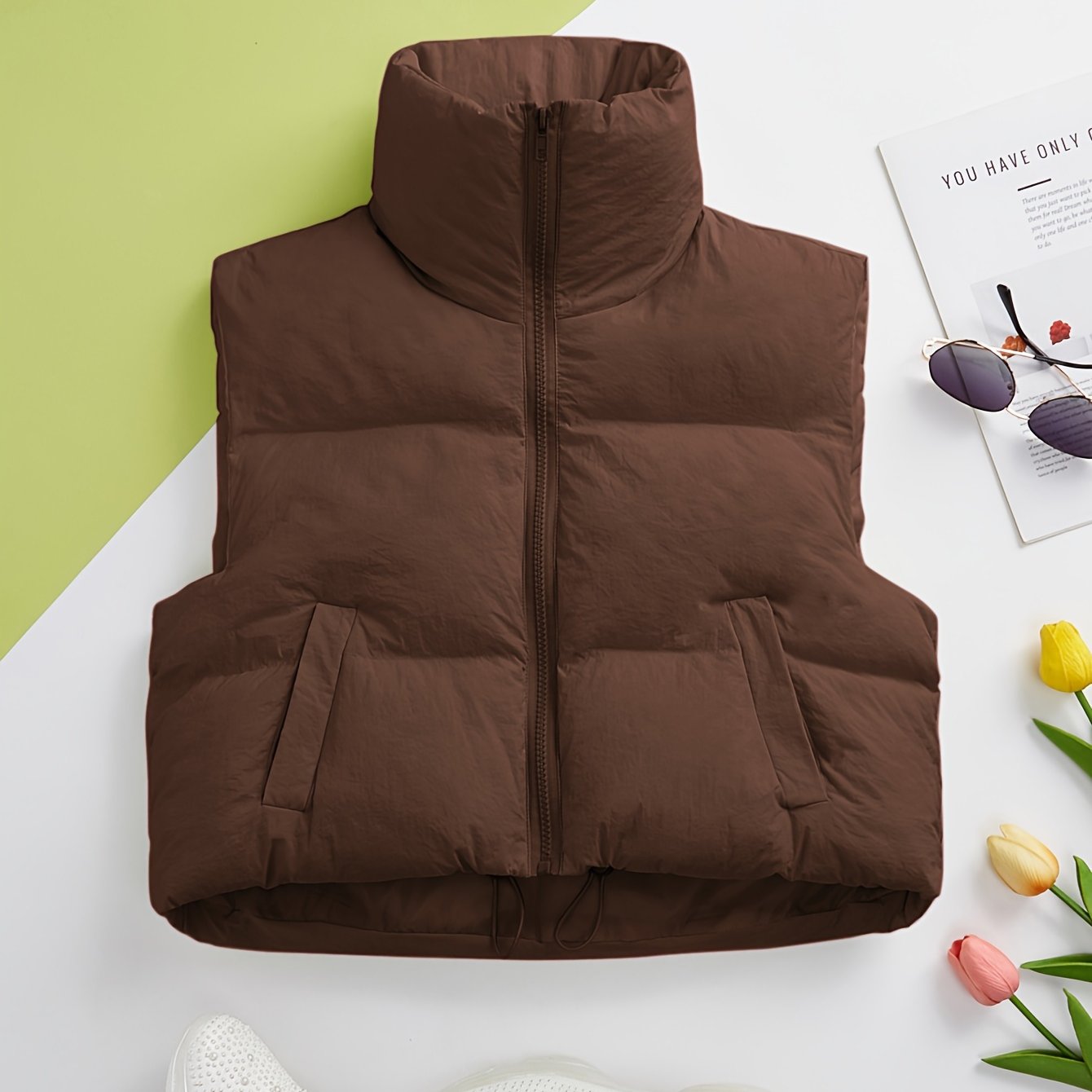 Women's solid zip-up puffy vest with casual sleeveless pockets, perfect for fall and winter.