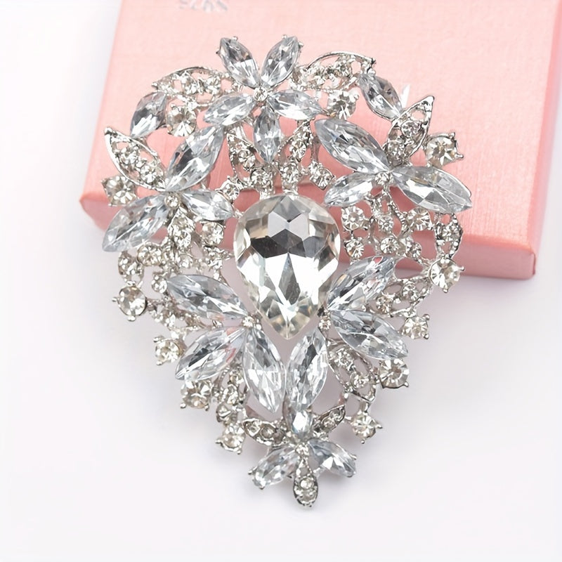 Add a touch of vintage elegance with this stunning Rhinestone Brooch Pin featuring an irregularly shaped large crystal glass design. Perfect for embellishing clothing and adding a luxurious touch to your fashion ensemble.