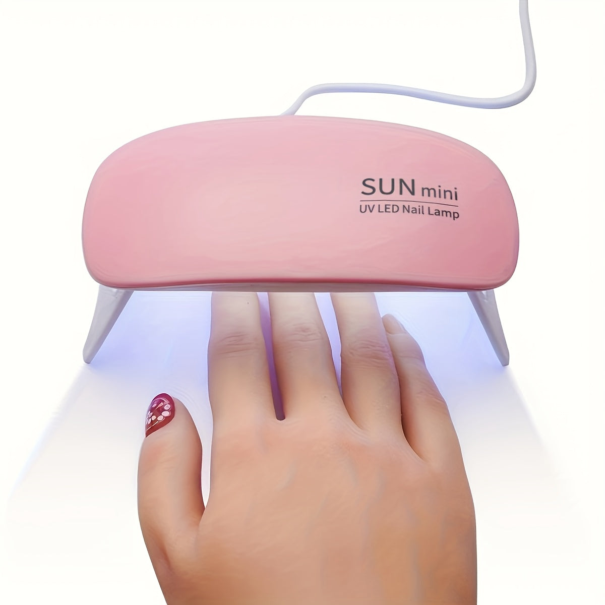 Portable mini nail lamp with 6 UV/LED light beads in pink and white. USB powered, foldable design, suitable for gel polishing and drying. Ideal for hand, foot, and nail care.