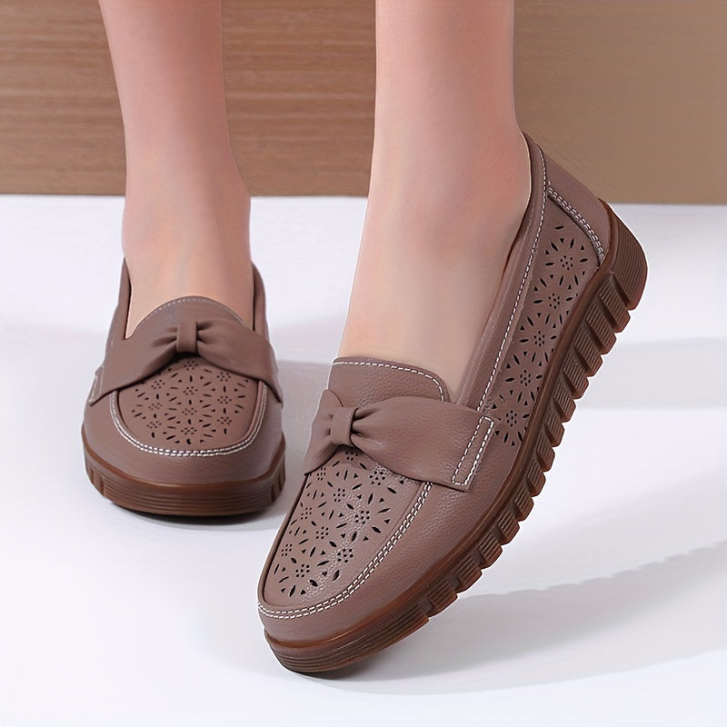 Women's breathable closed toe flat shoes with hollow out design.