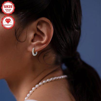 These earrings are made of 925 sterling silver and feature a pair of round Moissanite stones measuring 3mm each, with a total weight of 1.5 carats. The earrings are adorned with 30 Moissanite stones in total, each weighing 3.74 grams. This elegant design